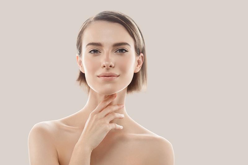 Portrait of a woman with short hair and smooth skin, symbolizing the results of ResurFX and OptiLIGHT treatments available at Dr. Monika Kiripolsky’s practice in Beverly Hills.